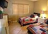 The recently updated guest bedroom has twin beds, cable TV and adjacent bath with shower.