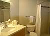 All new  guest bathroom with tile shower, glass tile accents, vanity with solid surface top & undermount sink.