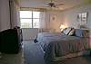 Master bedroom with king size bed, cable TV, walk in closet, adjoining bath with double vanity, large tub/shower and sliding glass doors onto the bay front balcony!