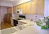 Central Gulf Coast Condominium rental - Interior Photo - Kitchen from Dining Room pass-through