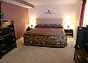 Master bedroom with king size bed, cable TV, walk-in closet and adjoining bath with tub/shower.