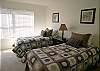 Guest Bedroom with twin beds, walk-in closet & adjoining bath with tile shower.  TV to be added in November 2011.