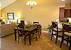 Dining table expands to seat 6-8 with additional chairs available.