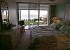 Master bedroom with king size bed, cable LCD TV/VCR, walk-in closet, adjoining bath with tub/shower and sliding glass doors to the bayfront patio.