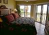 The master bedroom opens to the balcony with a beautiful view of the beach and has a king size bed and cable TV.
