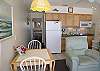 Kitchen includes dishwasher, microwave/convection oven and 2 burner flat panel stovetop.