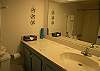 Full bath including tub/shower and large vanity.