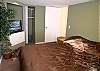 Ground floor bedroom with queen size bed &amp; flatscreen TV.
