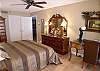 The Master Suite is beautifully appointed with king-size cherry bed, high boy, French desk with leather top, European oils, walk-in closet and adjoining bath with new tile shower, cabinets and double granite-topped vanity.
