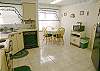 Roomy kitchen with new refrigerator.
