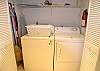 Washer & dryer, iron, ironing board and housekeeping equipment.