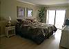 Master bedroom with new king size bed, cable tv, adjoining bath and a Gulf front balcony that is shared with the living room.