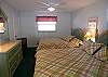 Second bedroom with two new queen size beds, cable TV and an adjoining bath with tub/shower.