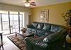 Living room with sliding glass doors to the bay front balcony.