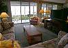 Living room with queen size sofabed, new 37 inch High Definition TV/DVD, stereo/cassette/CD and sliding doors to the bay front patio.