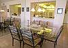 Large dining table with seating for six.