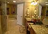 Spacious master bath with soaking tub, separate shower and double, granite topped vanities.