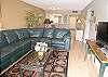 Comfortable leather reclining sofa & flatscreen cable TV/DVD.