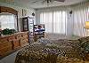 Master bedroom with queen size bed, new 32-inch LCD TV/DVD/VCR, walk-in closet and adjoining bath with oversized tub/shower.
