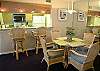 Tropical dining table, chairs and barstools.