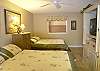 Second bedroom with two queen size beds, cable TV/VCR, huge closet and an adjoining bath with tub/shower.