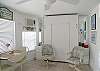 Bright and fresh tropical theme and a queen size Murphy bed