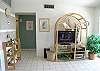 Entertainment center with new 32 inch flatscreen TV, DVD and stereo.  Adjacent sliding doors open onto the balcony with bay view.