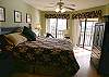 Master bedroom with king size bed, sliding doors onto the balcony, cable TV/DVD, walk-in closet and adjoining bath with tub/shower.