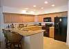Kitchen with maple cabinets & granite counters.