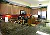 The spacious kitchen has the latest appliances, graite counters and is fully equipped.