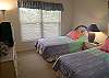 Twin beds in the guest room, cable TV/VCR and and adjacent bath with tile shower.