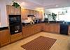 Huge, fully equipped kitchen with granite counters and high-end appliances.