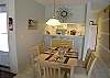 Seating for 4 at the table and 2 barstools at the counter.