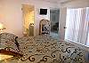 Bedroom with queen size bed, adjoining bath with tub/shower and new flatscreen TV & DVD. Radio/CD player too! There are also beach chairs & umbrella in the closet for your use.