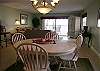This corner floorplan has two side windows and sliding glass doors in the living area.