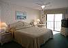 Master bedroom with Gulf front balcony, king size bed, cable TV, walk-in closet and an adjoining bath.
