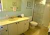 Newly repainted guest bath with tile shower.