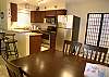 New dining table & chairs and two barstools at the granite counter.