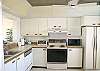 Side by side refrigerator, stove with self cleaning oven, dishwasher, disposal & washer/dryer make the kitchen complete.