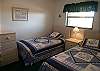 Third bedroom with two twin beds.
