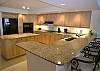 Spacious kitchen with granite countertops.