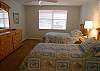 Second bedroom with twin beds and adjoining full bath.