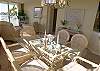 A nice big dining table with seating for six.