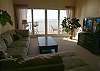 Roomy sectional sofa, wide screen TV/DVD and sliding doors to the Gulf front balcony.