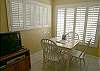 There is a dining table for four, stereo/cd player and a tv/vcr/dvd. The windows look out to the beach & the condo is on the ground floor.
