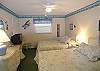 Second bedroom with two queen size beds, cable TV, walk-in closet & an adjoining bath with tub/shower.