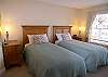 Guest bedroom with extra long twin beds.