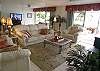 Bayfront living room with leather furniture.