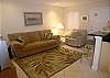 Living area with queen sofabed, side chair &amp; cable TV
