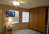 The Murphy bed can be closed when not in use.